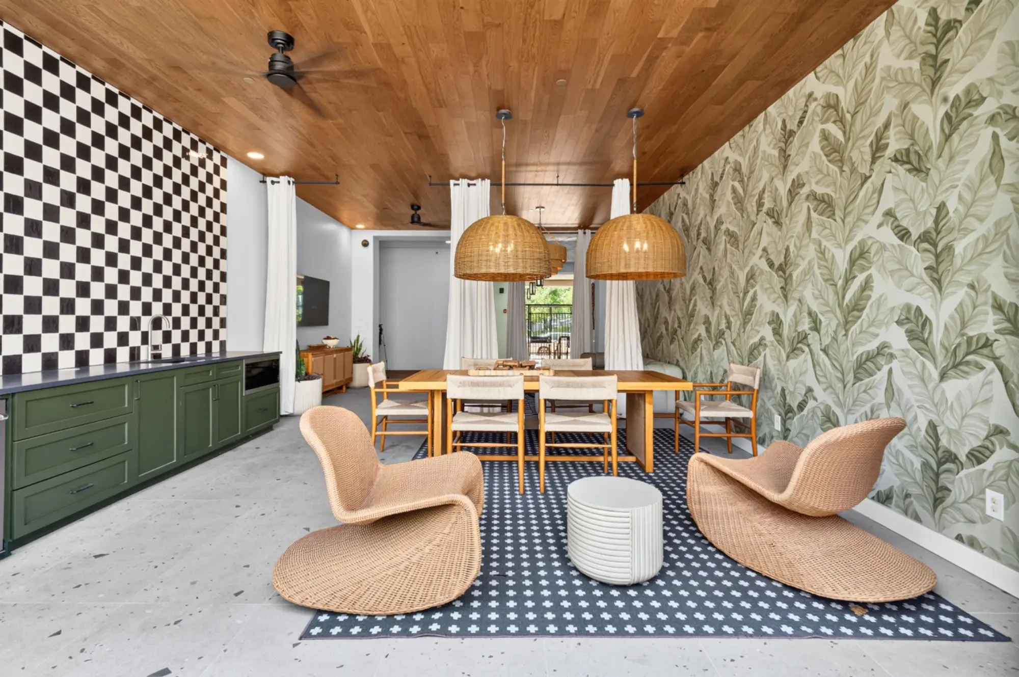 Renovated multifamily amenity dining room with custom cabinetry, wood ceiling, architectural lighting, and decorative finishes