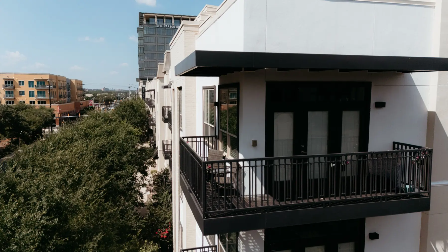 Exterior balcony, railing, canopy, and facade detail